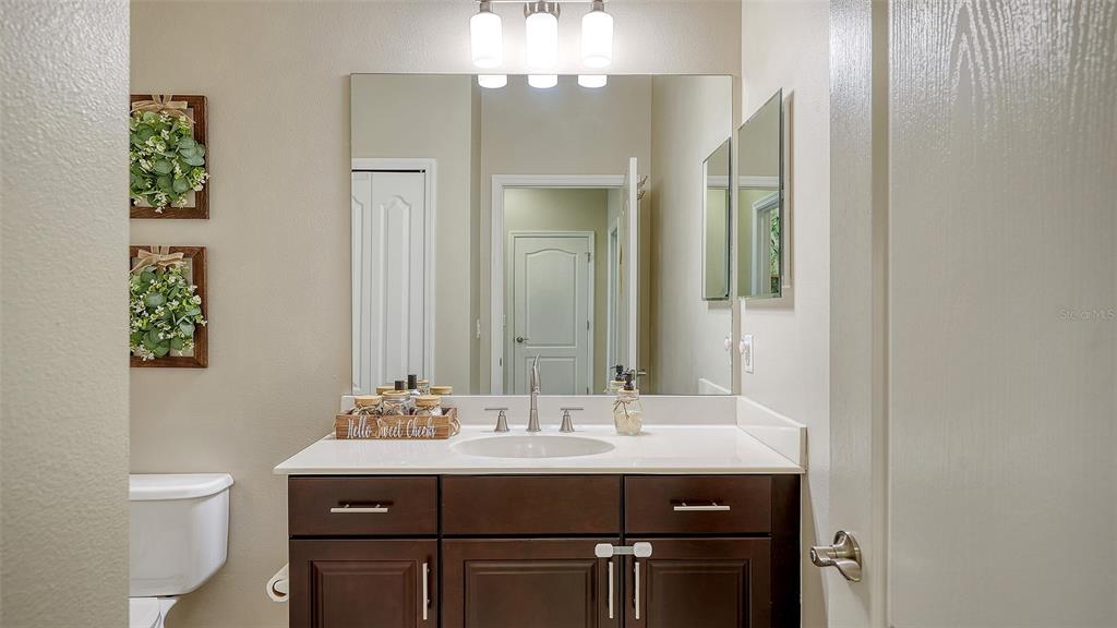 1318 Westover Avenue Parrish, FL 34219 - Photo 20 of 42 a bathroom with a sink and a mirror