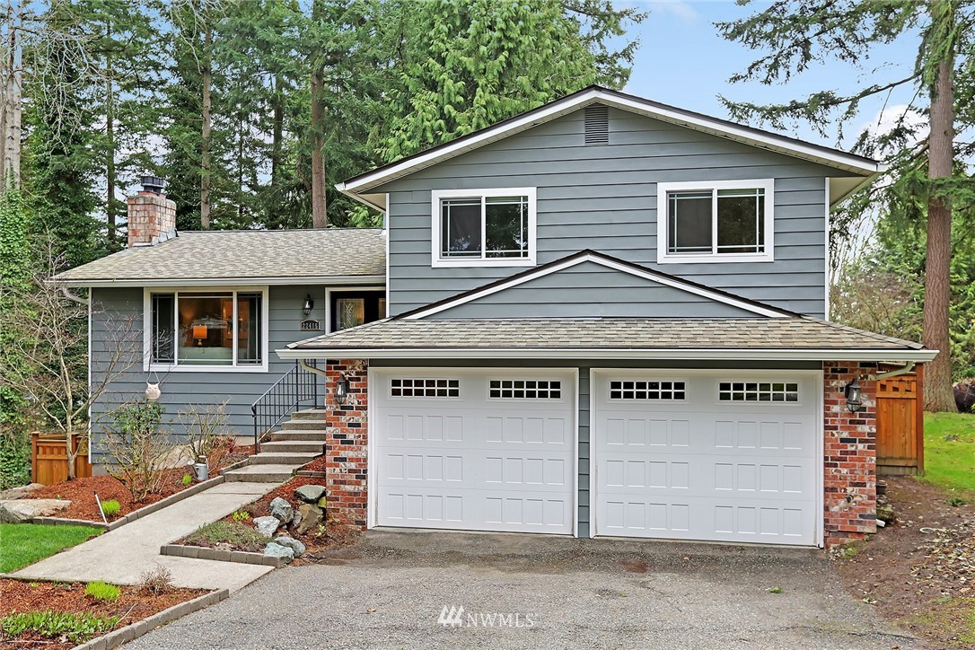 22415 1st Drive Southeast Bothell, WA 98021 - Photo 1 of 24 a view of a house with a garage and yard