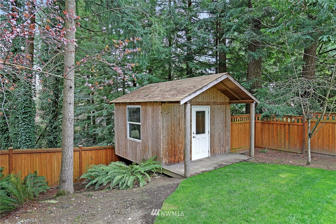 22415 1st Drive Southeast Bothell, WA 98021 - Photo 23 of 24 a view of a house with a yard plants and large tree
