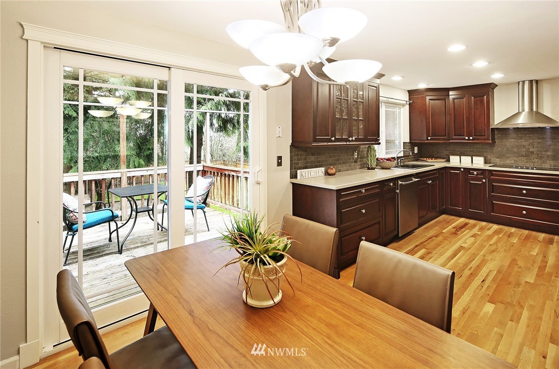 22415 1st Drive Southeast Bothell, WA 98021 - Photo 7 of 24 a kitchen with a table chairs stove and kitchen view