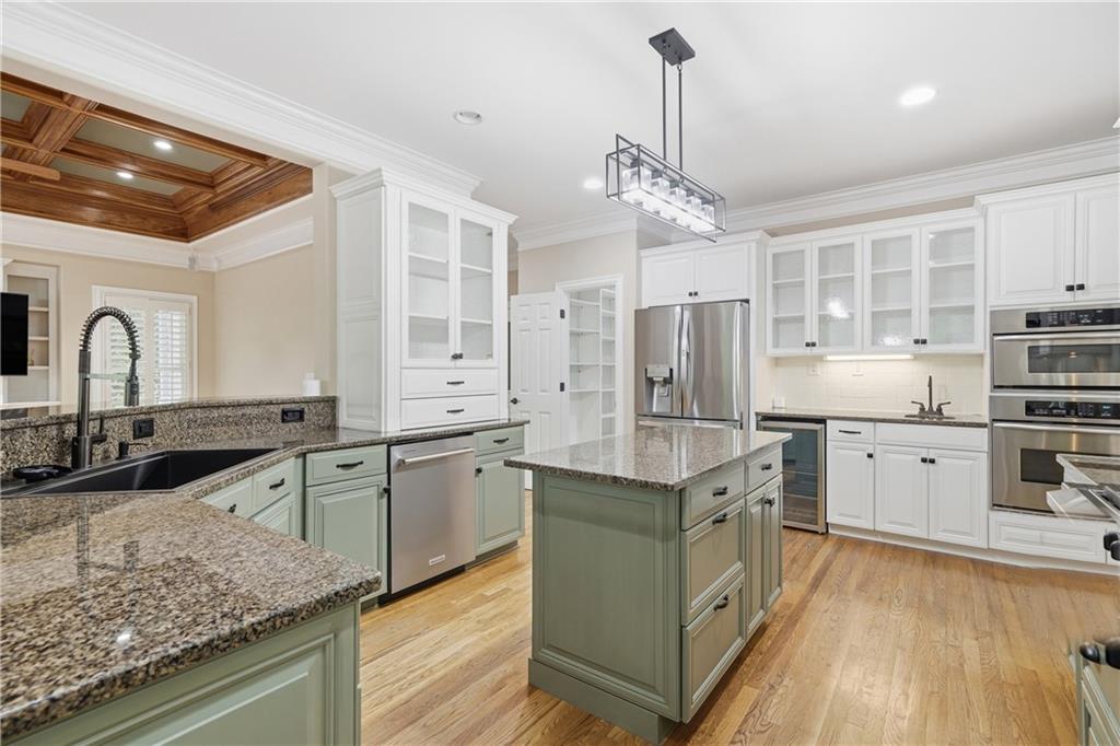 4185 Pool Road Winston, GA 30187 - Photo 12 of 39 a kitchen with stainless steel appliances granite countertop a sink stove and refrigerator