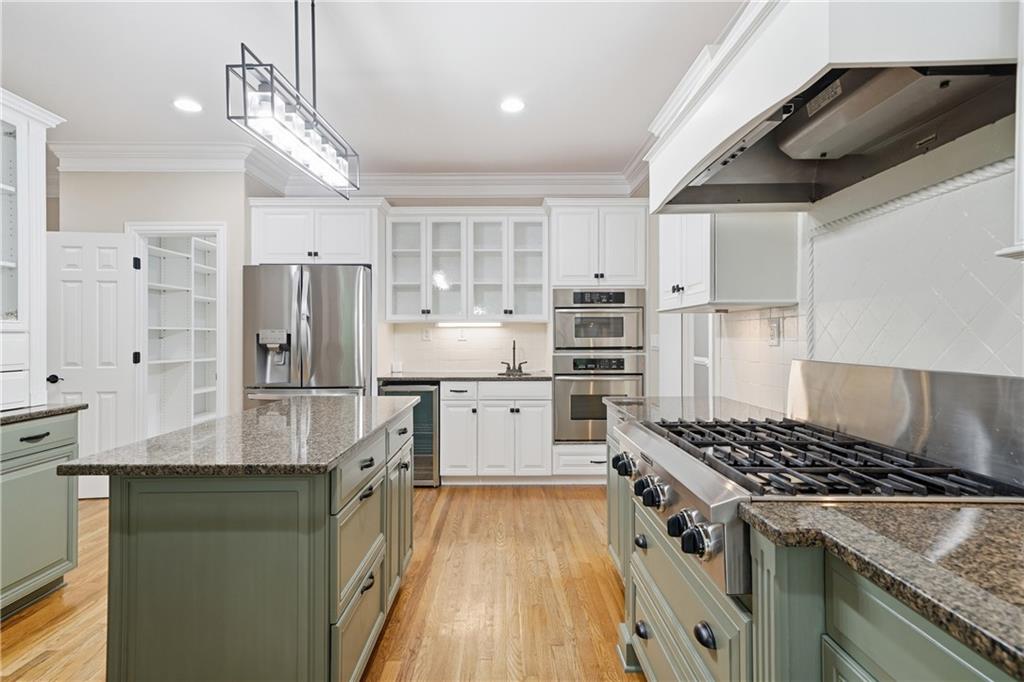 4185 Pool Road Winston, GA 30187 - Photo 13 of 39 a kitchen with stainless steel appliances granite countertop a stove and a refrigerator