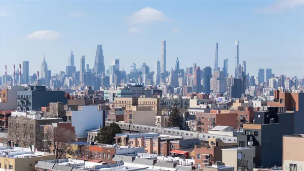 a view of a city with tall buildings