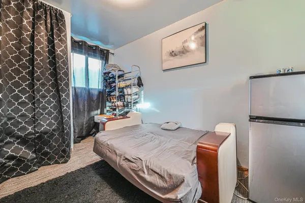 a bedroom with a bed and a table in it