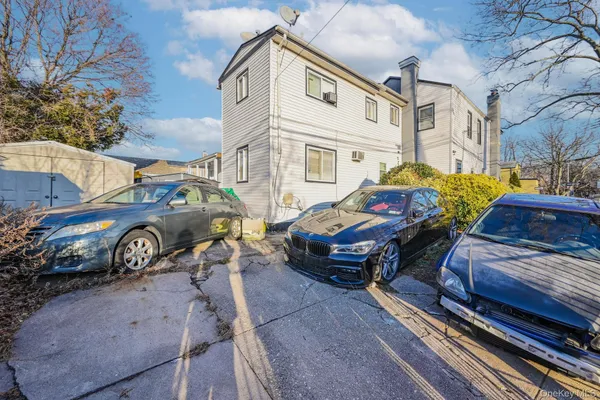 a view of a car park in front of house