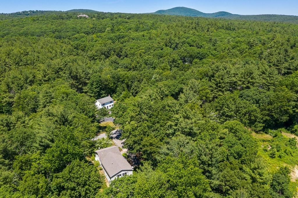37 Coal Kiln Road Princeton, MA 01541 - Photo 3 of 26 a view of a lush green field with a houses in the background