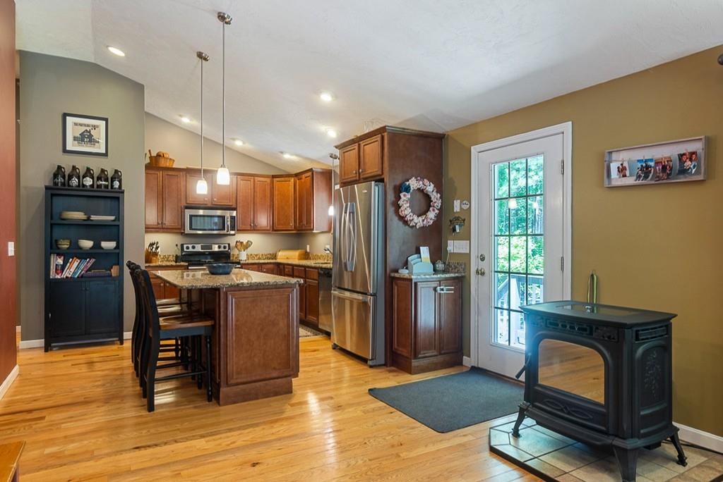37 Coal Kiln Road Princeton, MA 01541 - Photo 7 of 26 a kitchen with a refrigerator cabinets and wooden floor
