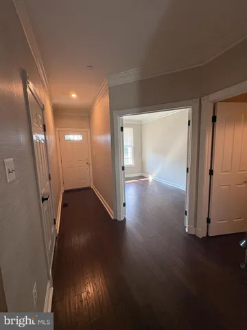 a view of gallery with wooden floor