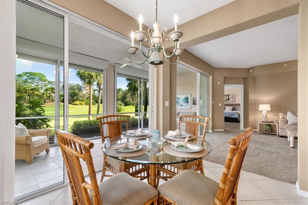 2090 Aberdeen Lane, Unit 101 Naples, FL 34109 - Photo 18 of 42 a view of a dining room with furniture window and outside view