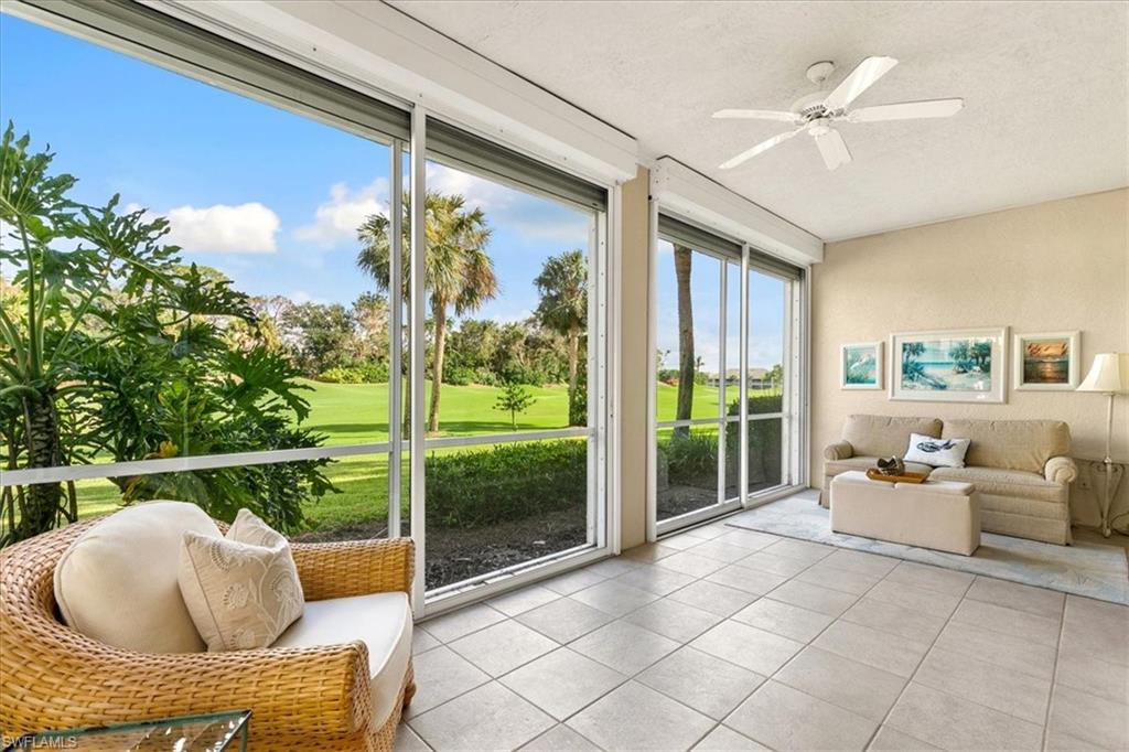 2090 Aberdeen Lane, Unit 101 Naples, FL 34109 - Photo 19 of 42 a roof deck with table and chairs and potted plants