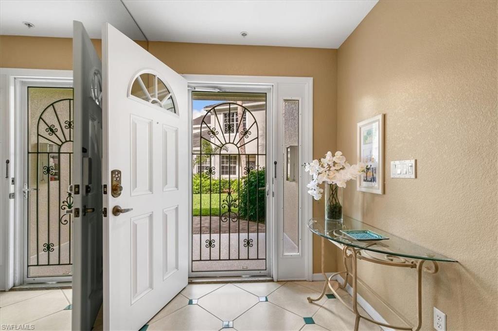 2090 Aberdeen Lane, Unit 101 Naples, FL 34109 - Photo 24 of 42 a view of a entryway door front of a house