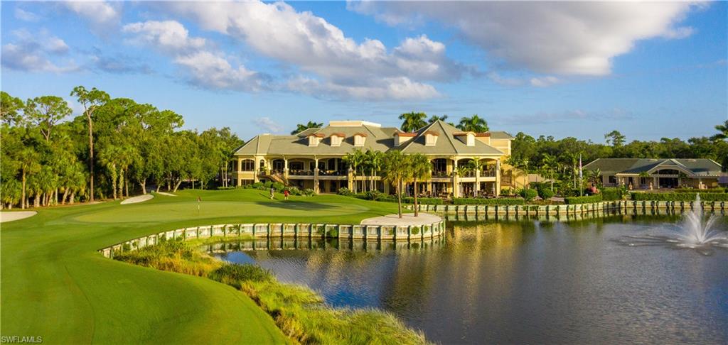 2090 Aberdeen Lane, Unit 101 Naples, FL 34109 - Photo 30 of 42 a view of a lake with houses
