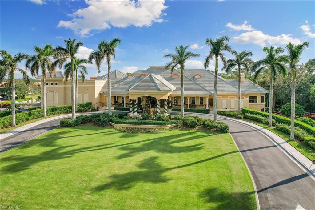 2090 Aberdeen Lane, Unit 101 Naples, FL 34109 - Photo 31 of 42 a front view of a house with swimming pool garden and patio
