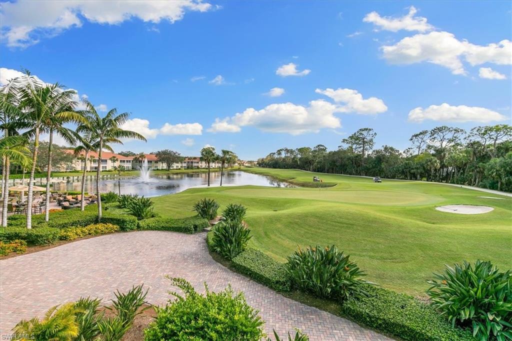 2090 Aberdeen Lane, Unit 101 Naples, FL 34109 - Photo 32 of 42 a view of a lake with a big yard