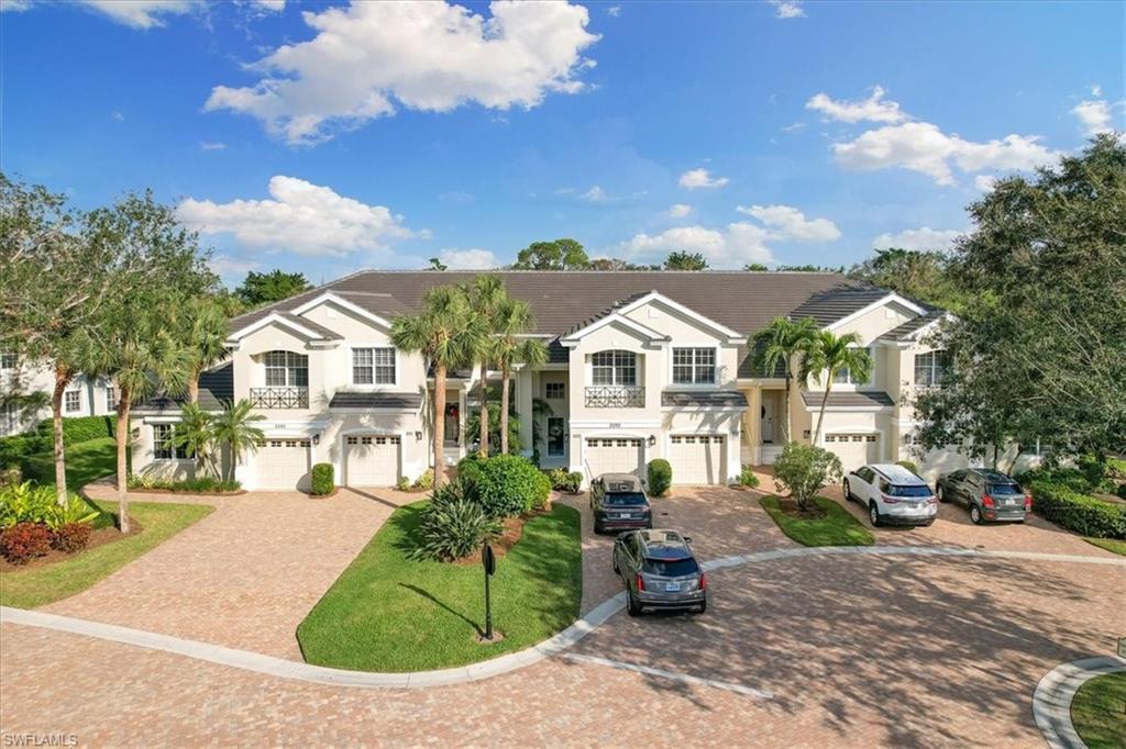 2090 Aberdeen Lane, Unit 101 Naples, FL 34109 - Photo 35 of 42 a view of multiple houses with a yard