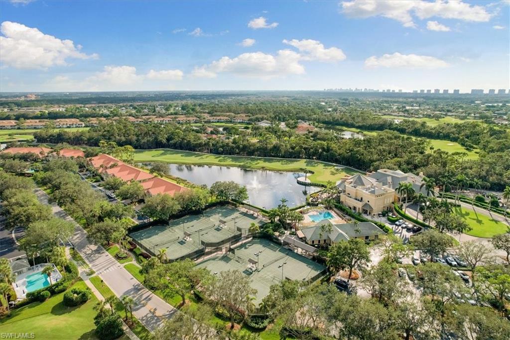 2090 Aberdeen Lane, Unit 101 Naples, FL 34109 - Photo 41 of 42 an aerial view of lake residential house with outdoor space and trees around