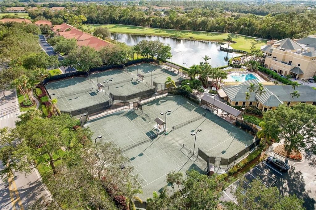 2090 Aberdeen Lane, Unit 101 Naples, FL 34109 - Photo 42 of 42 an aerial view of a house with a lake view