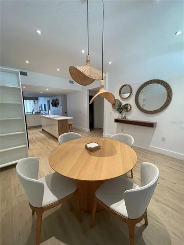 a kitchen with a table and chairs