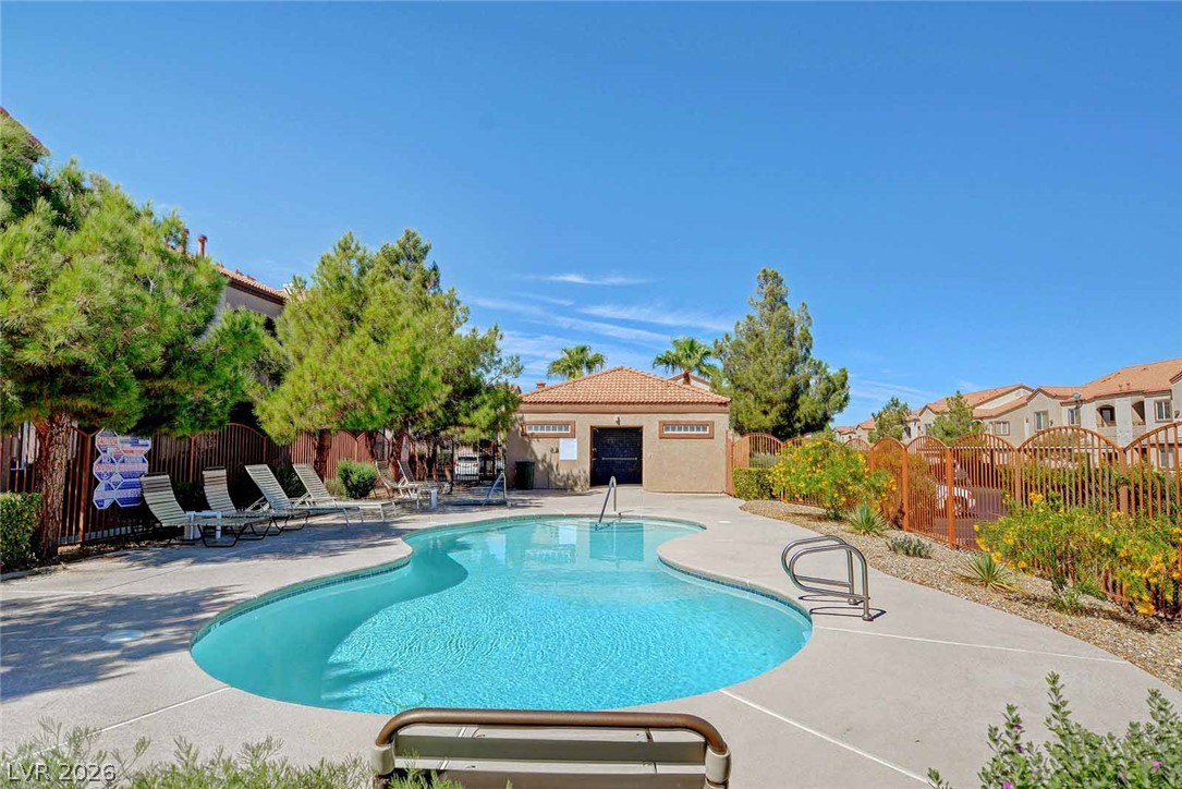 9580 West Reno Avenue, Unit 134 Las Vegas, NV 89148 - Photo 39 of 41 A free-form community pool offers a refreshing oasis with ample space for relaxation under the sun.