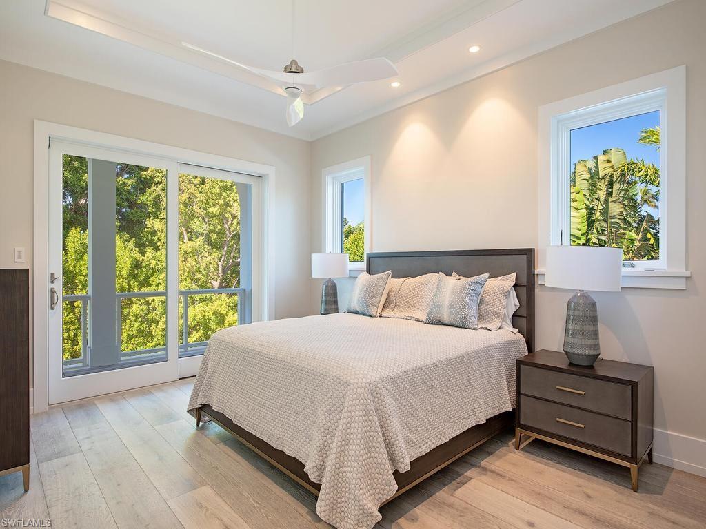 225 4th Avenue North Naples, FL 34102 - Photo 17 of 42 a bedroom with a bed and a window