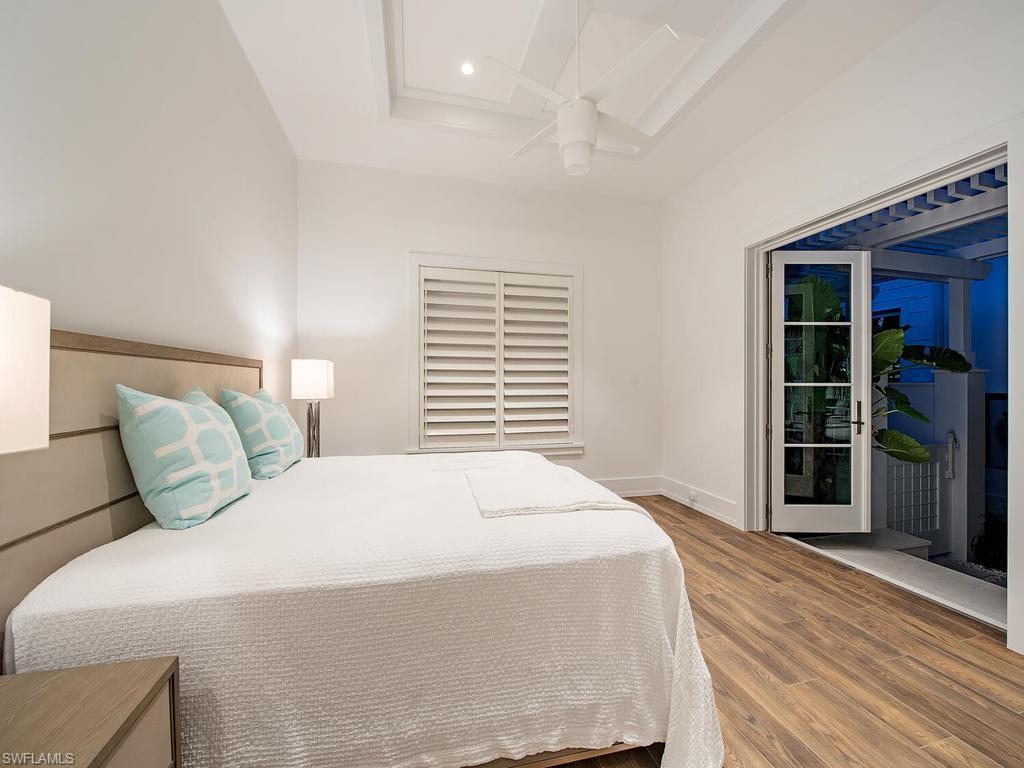 225 4th Avenue North Naples, FL 34102 - Photo 21 of 42 a bedroom with a bed and a window