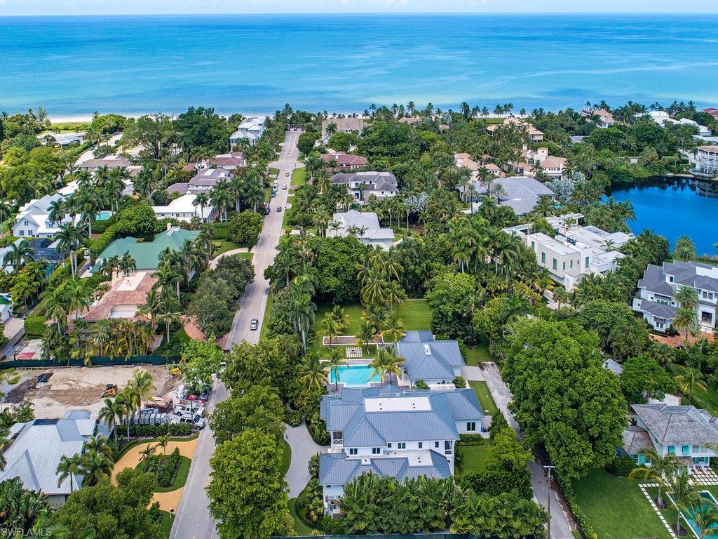 225 4th Avenue North Naples, FL 34102 - Photo 30 of 42 an aerial view of residential houses with outdoor space and ocean