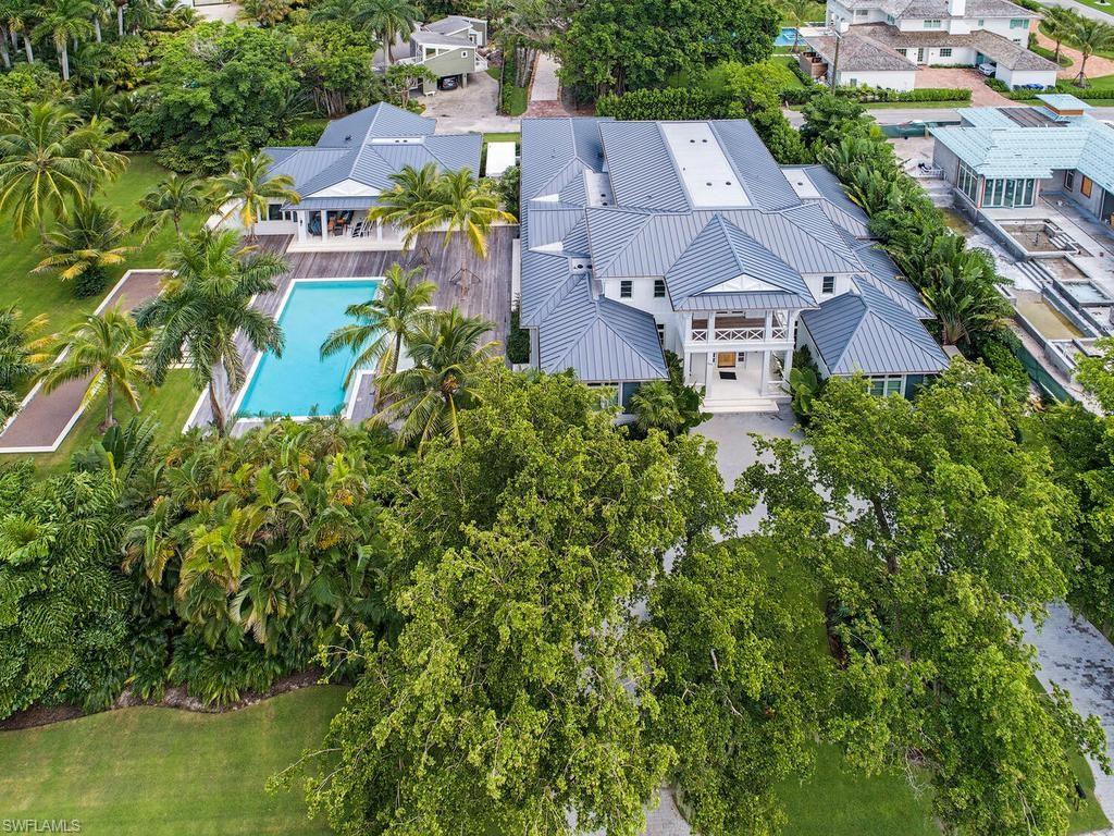 225 4th Avenue North Naples, FL 34102 - Photo 33 of 42 an aerial view of residential houses with outdoor space and trees