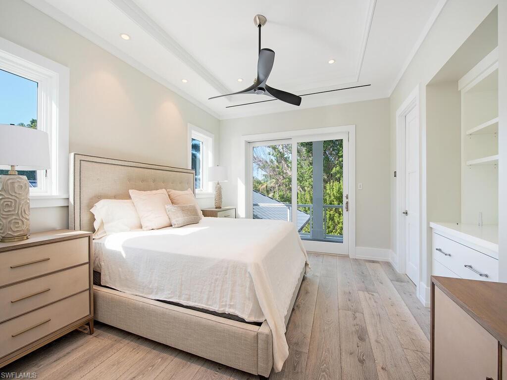 225 4th Avenue North Naples, FL 34102 - Photo 33 of 41 a bedroom with a large bed and a window