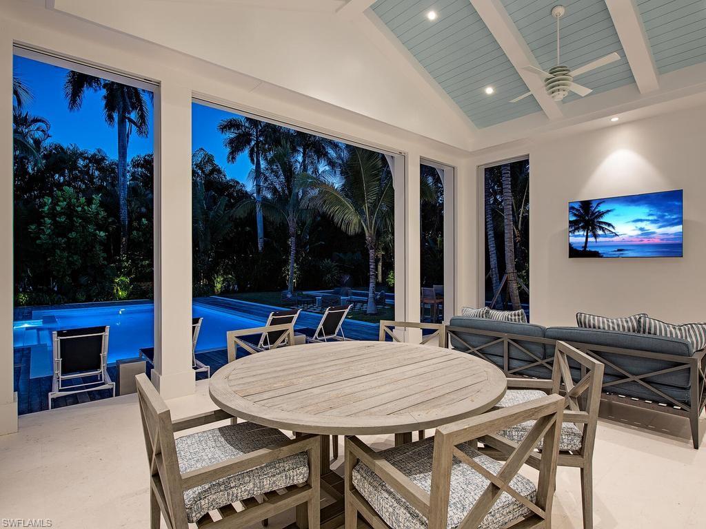 225 4th Avenue North Naples, FL 34102 - Photo 36 of 42 a view of a dining room with furniture window and outside view