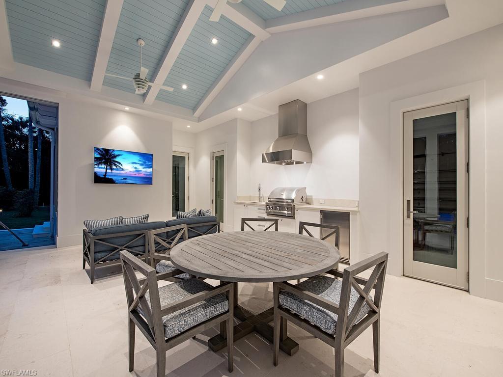 225 4th Avenue North Naples, FL 34102 - Photo 37 of 42 a view of a dining room with furniture