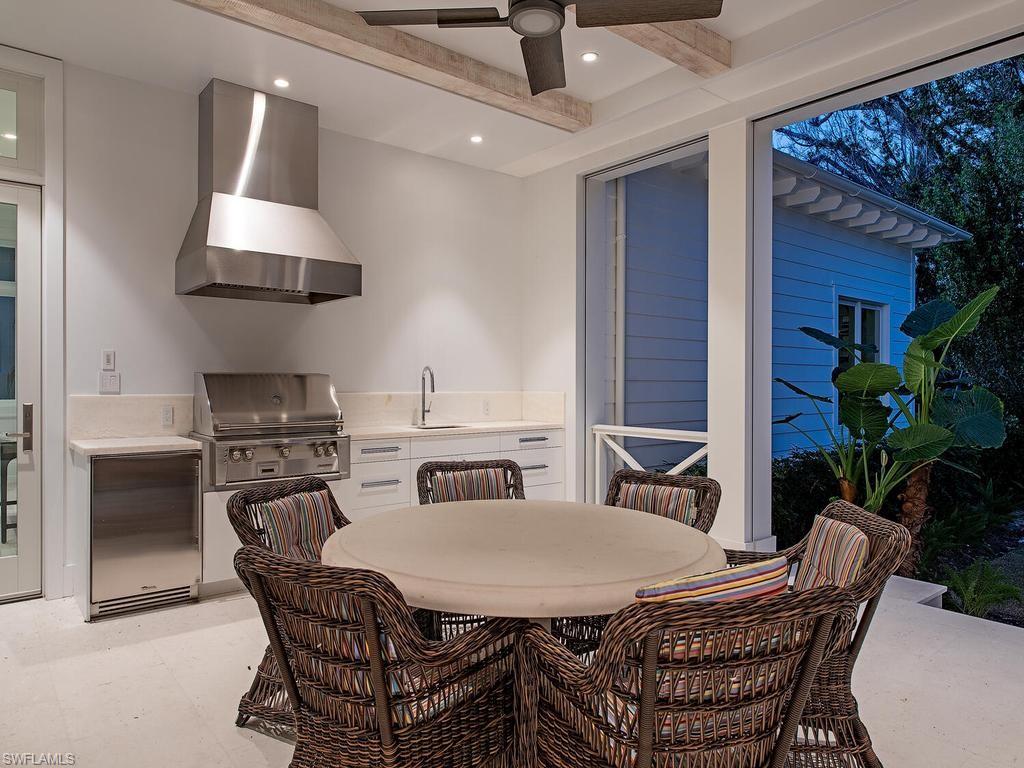 225 4th Avenue North Naples, FL 34102 - Photo 39 of 42 a view of a dining room with furniture