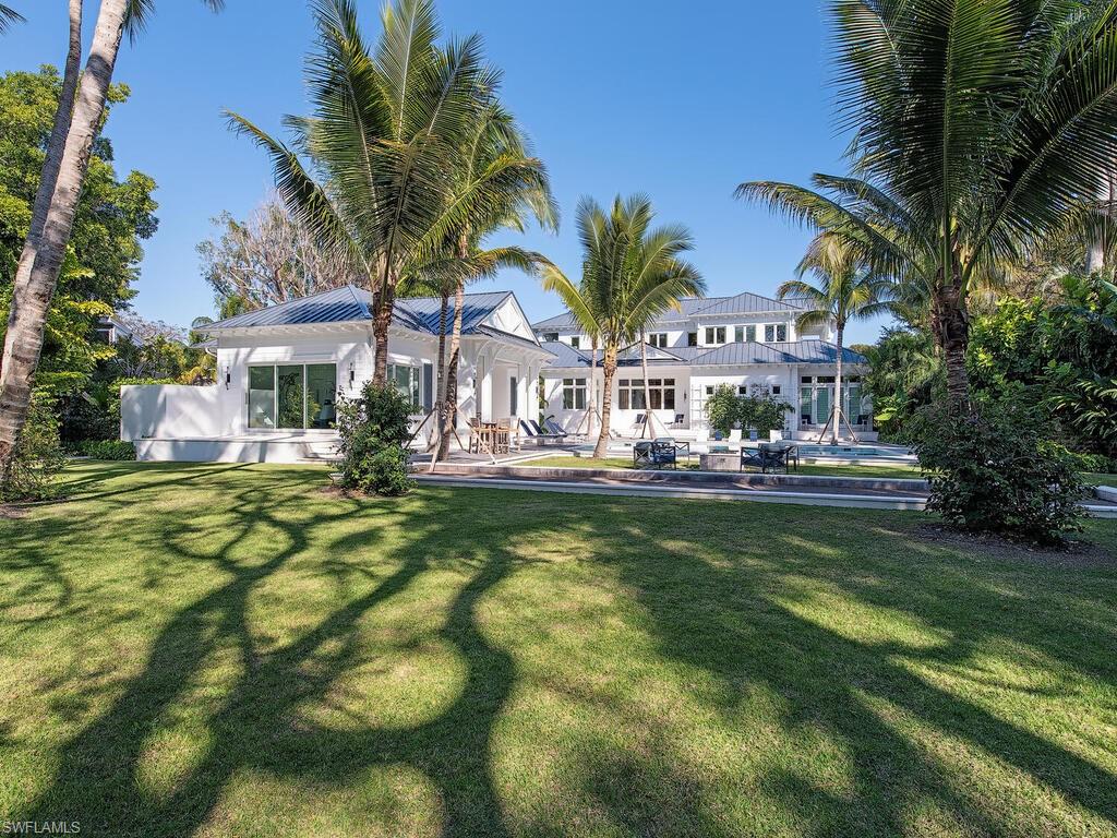 225 4th Avenue North Naples, FL 34102 - Photo 39 of 41 a view of swimming pool and outdoor seating