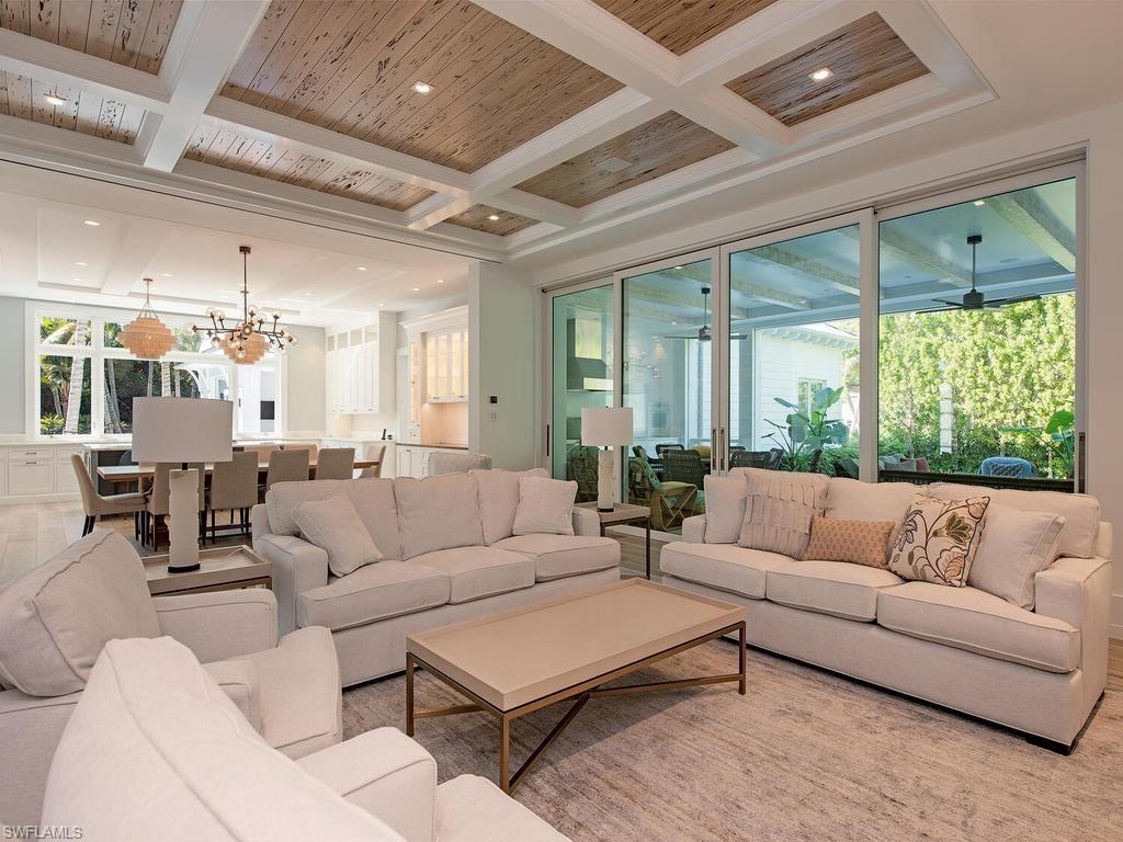 225 4th Avenue North Naples, FL 34102 - Photo 4 of 42 a living room with furniture and a large window