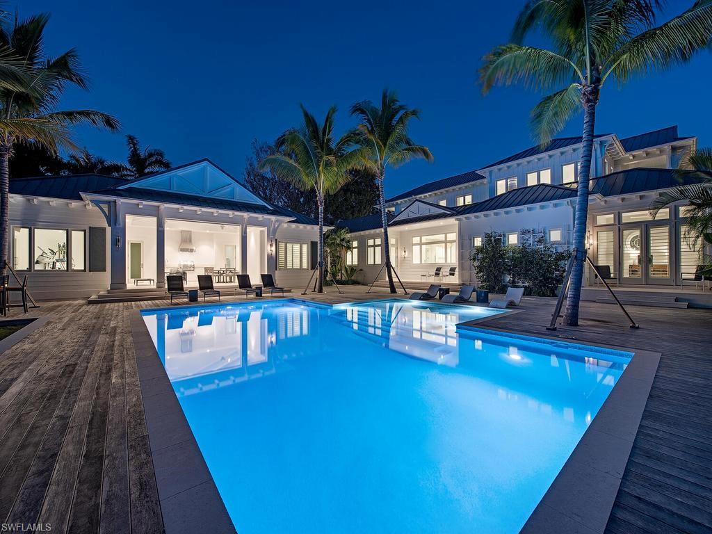 225 4th Avenue North Naples, FL 34102 - Photo 41 of 42 a view of a swimming pool with a patio