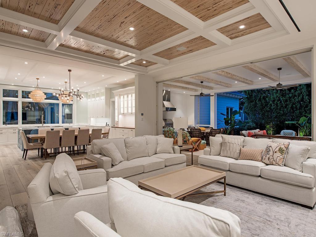 225 4th Avenue North Naples, FL 34102 - Photo 5 of 42 a living room with furniture and a large window