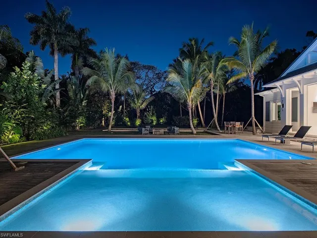 a view of swimming pool with outdoor seating