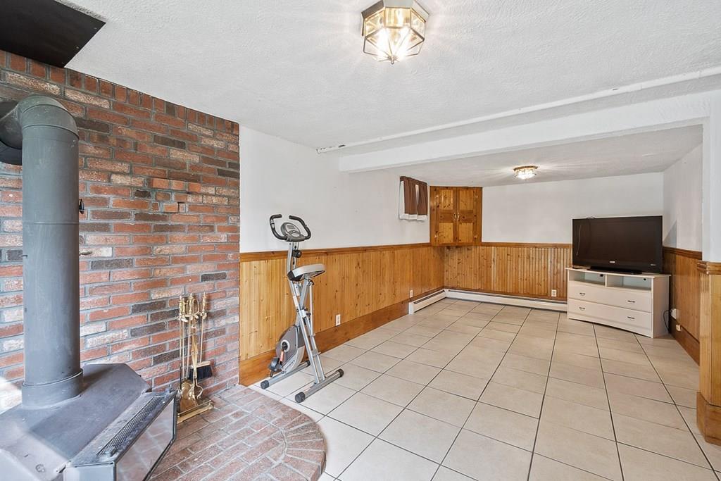 24 Springwell Road Billerica, MA 01821 - Photo 12 of 16 a view of a livingroom with furniture and a flat screen tv