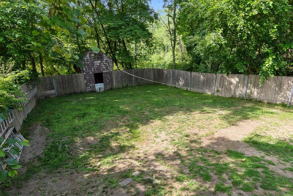 24 Springwell Road Billerica, MA 01821 - Photo 16 of 16 a view of a backyard with a trees