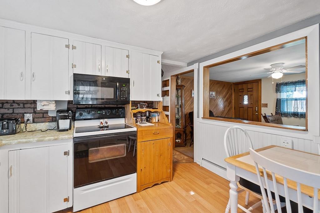 24 Springwell Road Billerica, MA 01821 - Photo 3 of 16 a kitchen with stainless steel appliances granite countertop a sink stove and refrigerator