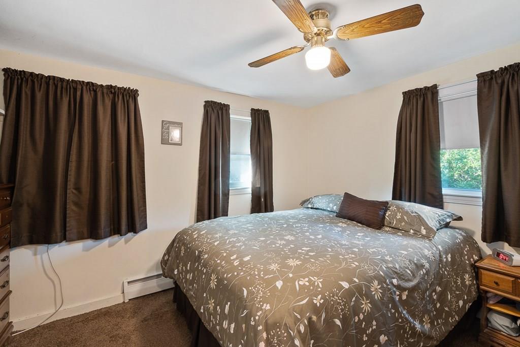 24 Springwell Road Billerica, MA 01821 - Photo 7 of 16 a bedroom with a bed and a large window