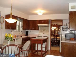 85 Euston Road South Marlton, NJ 08053 - Photo 2 of 6 a kitchen with cabinets a sink and chairs