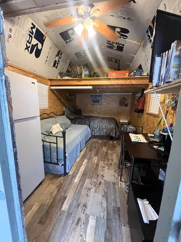 a view of washer and dryer with wooden floor