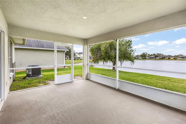 a view of a room with wooden floor and fence