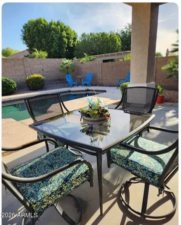 a view of a chairs and table in the terrace