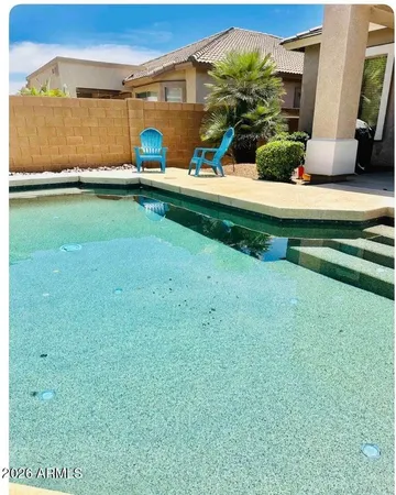 a view of a backyard with a garden and plants