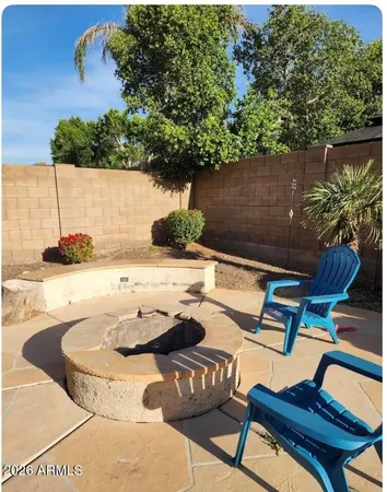 a view of a chairs and table in the patio