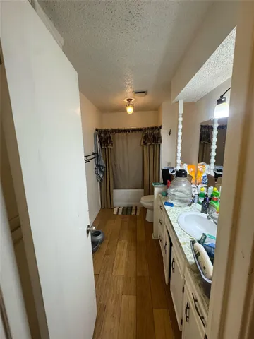 a bathroom with a sink a mirror and a shower