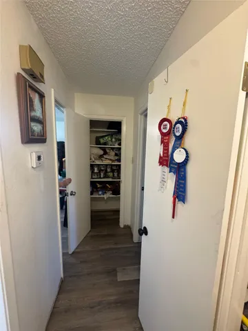 a view of an entryway with wooden floor