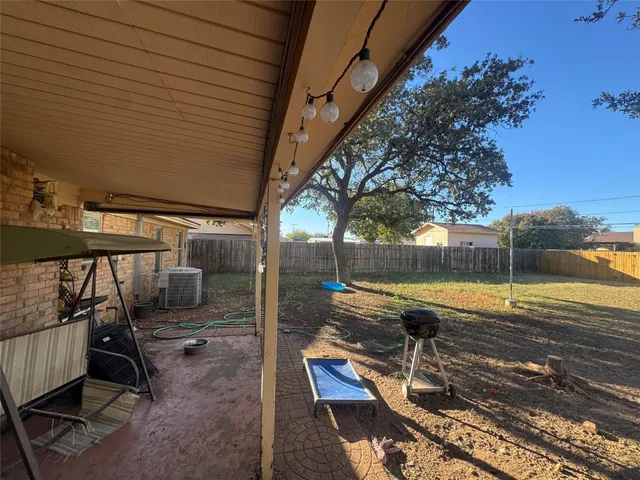 a view of a swimming pool with a patio