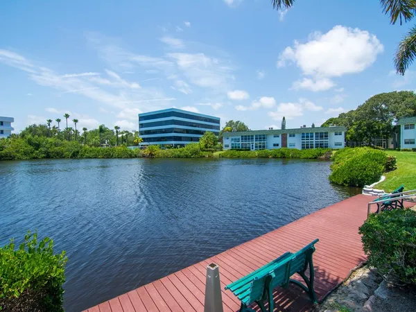 a view of a lake with houses in the back